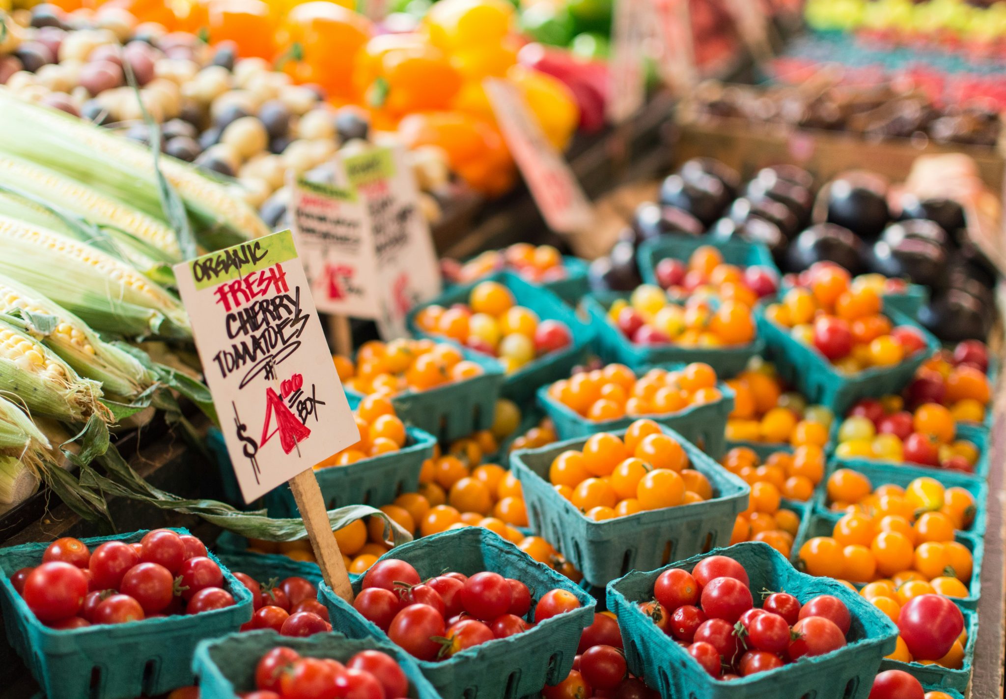 Crates of tomatoes delivered to a grocery and retail store