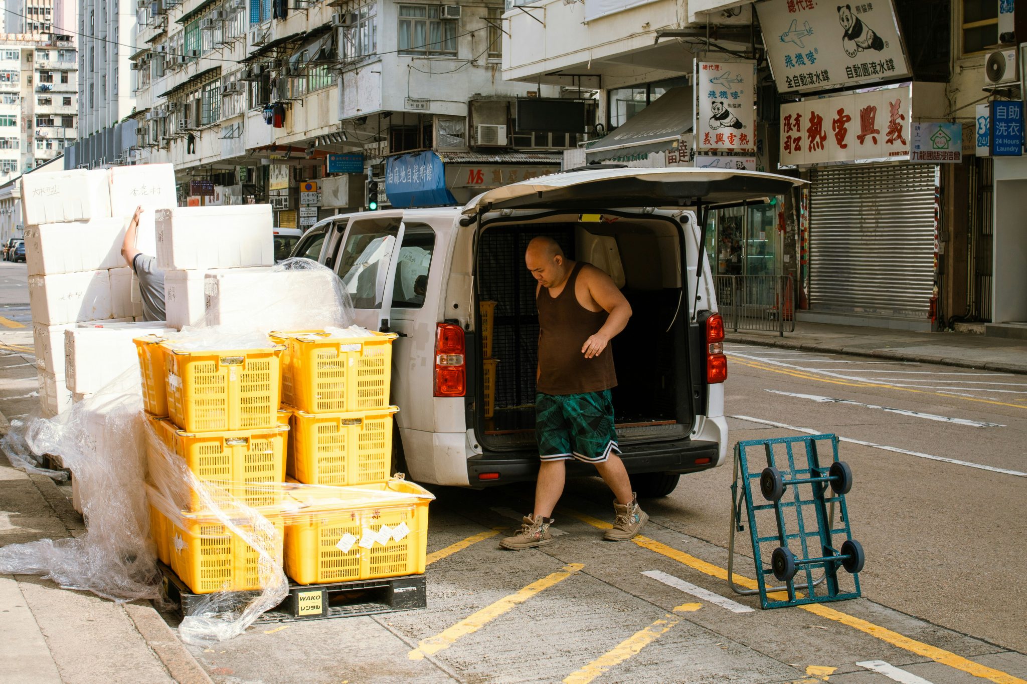 Food crates being unloaded from a delivery vehicle at a customer site