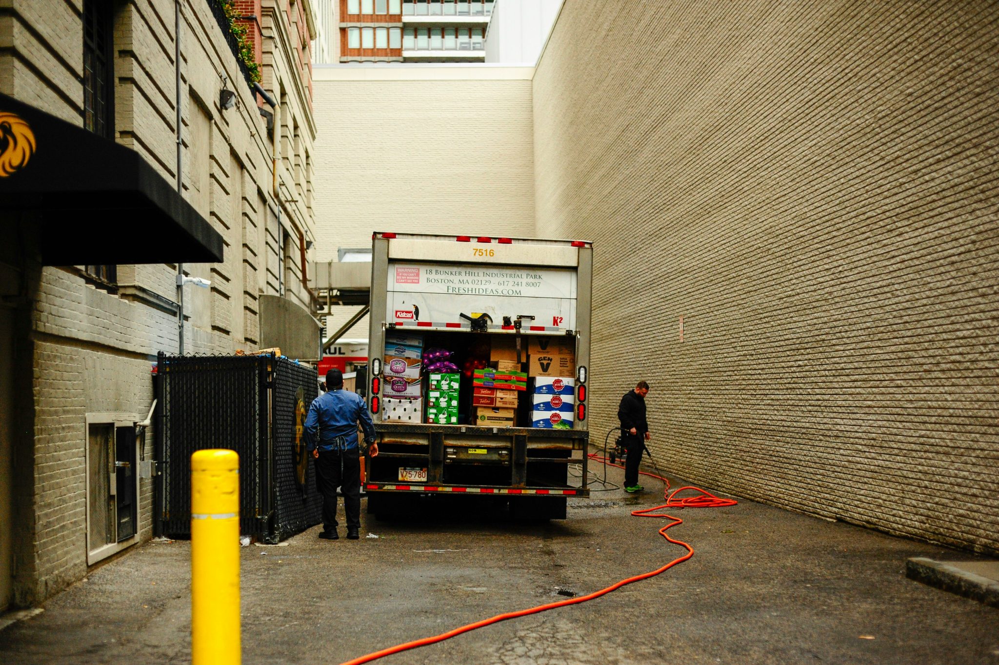 Team unloading a delivery vehicle during a scheduled food drop