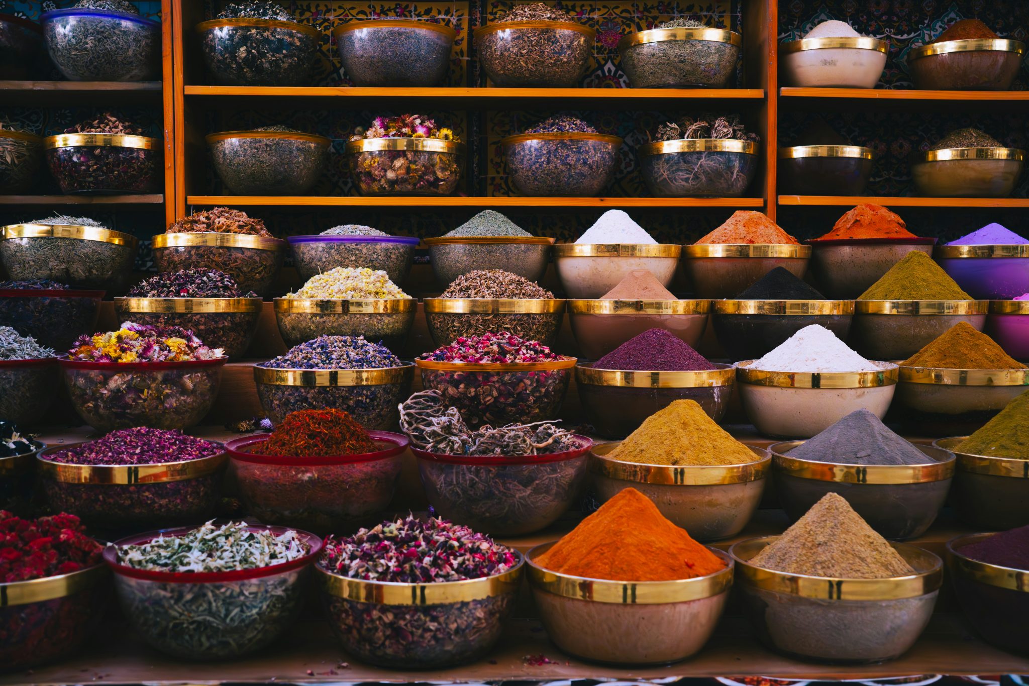 Whole spices and seasoning blends in bowls and jars